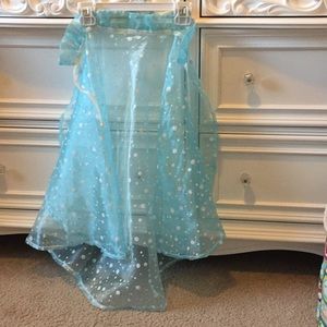 Blue cape with white polka dots